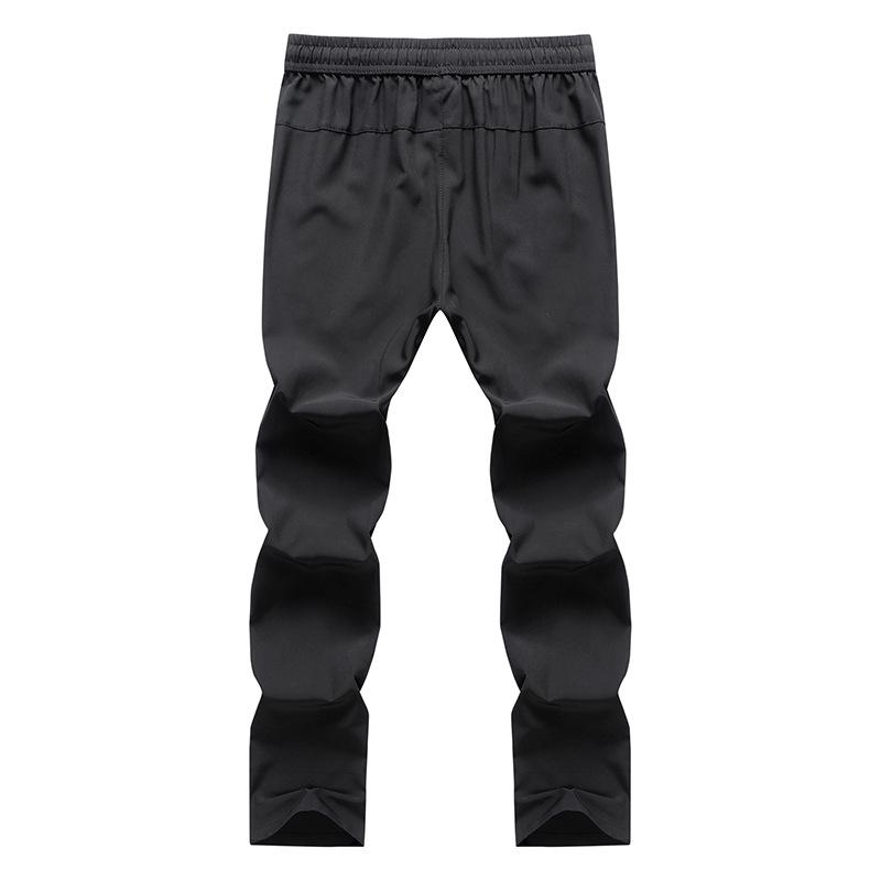 Изображение товара: Летние мужские шелковые брюки , тонкие дышащие свободные растягивающиеся брюки большого размера , быстросохнущие повседневные спортивные брюки для фитнеса