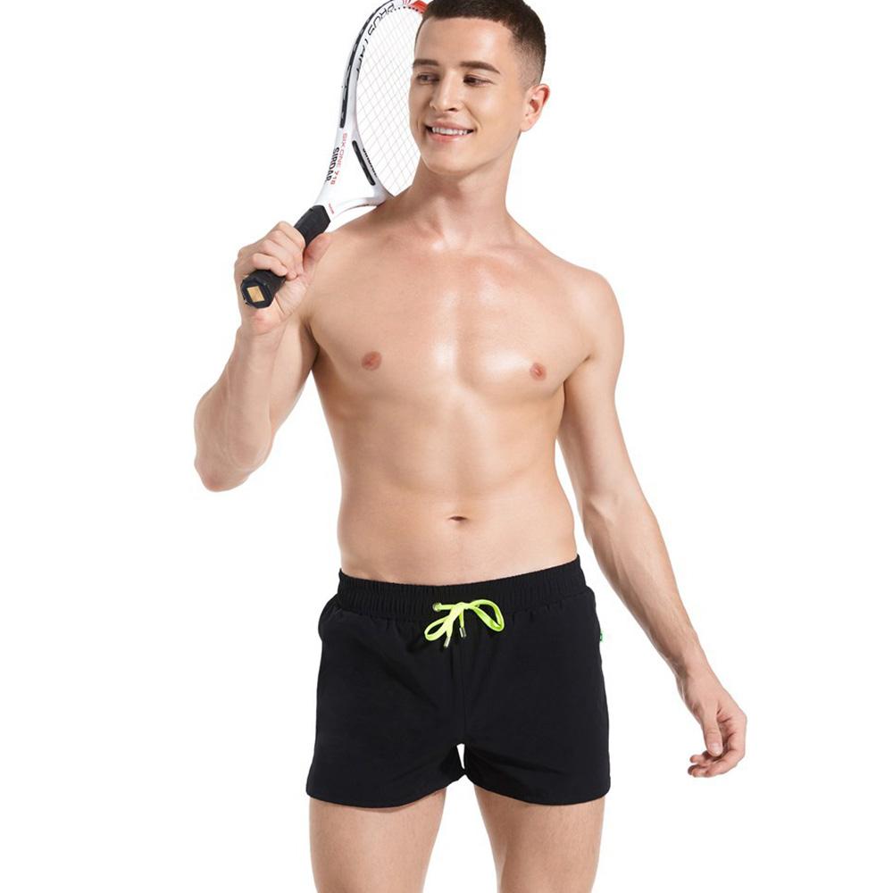 Изображение товара: 2020 мужские Новые Пляжные штаны однотонные быстросохнущие брюки Европейская и американская мода тонкие спортивные шорты пляжные плавательные спортивные