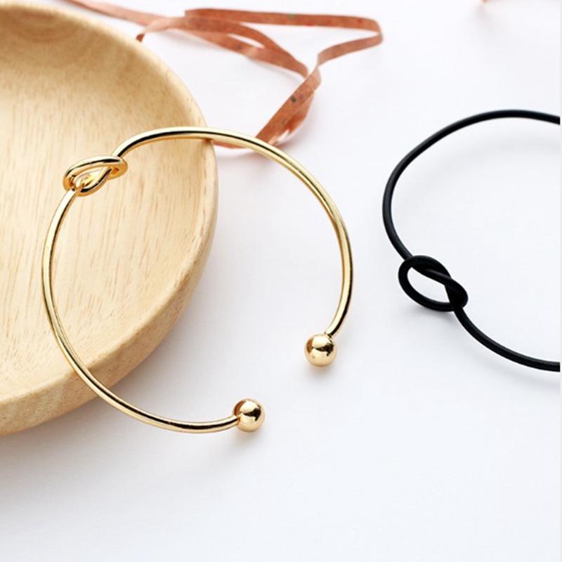 Изображение товара: Модные круглые браслеты-манжеты с круглым открытым узлом для женщин, элегантные ювелирные изделия золотого цвета, браслеты-манжеты с галстуком