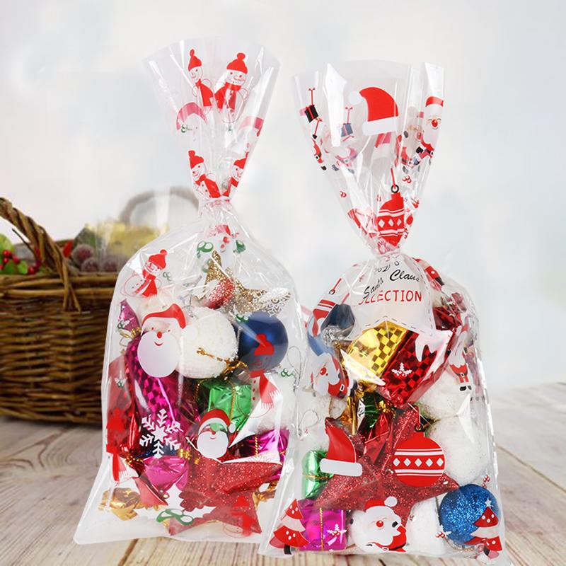 Изображение товара: 50 шт./лот, упаковка для выпечки на Рождество, пластиковые пакеты, Рождественский Санта-Клаус, снеговик, Снэк, конфета, мешок для хранения печенья, конфет