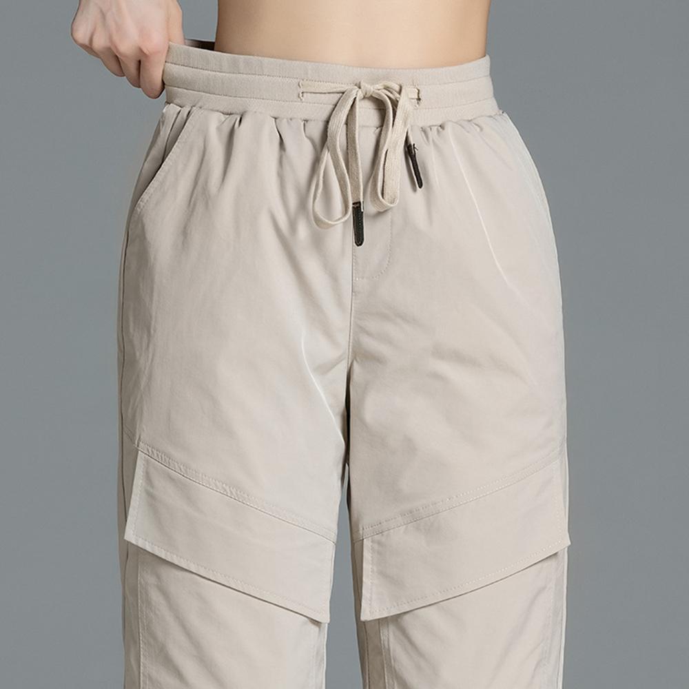Изображение товара: Женские пуховые брюки с эластичной резинкой на талии, с хлопковой подкладкой, утолщенные, для похудения, большие размеры, зимние ветрозащитные Брюки для ног, зимняя одежда