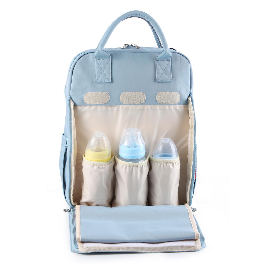 Изображение товара: Сумка для подгузников, большая емкость, сумка для подгузников, водонепроницаемый дорожный рюкзак для беременных, дизайнерская сумка для ухода за ребенком, сумка для детской коляски, новинка