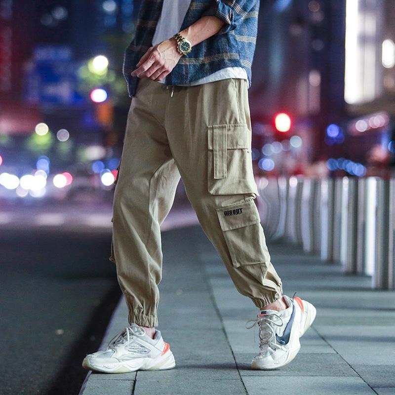 Изображение товара: Мужские повседневные брюки с несколькими карманами, мужские брюки в стиле хип-хоп, модные брюки с эластичной резинкой на талии больших размеров, брюки-карго высокого качества, мужская одежда 5XL