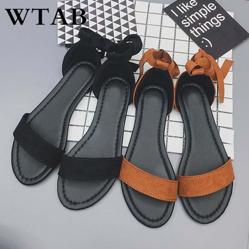 Изображение товара: Сандалии WTAB женские на шнуровке, повседневные однотонные пляжные босоножки, плоская подошва, лето 2019