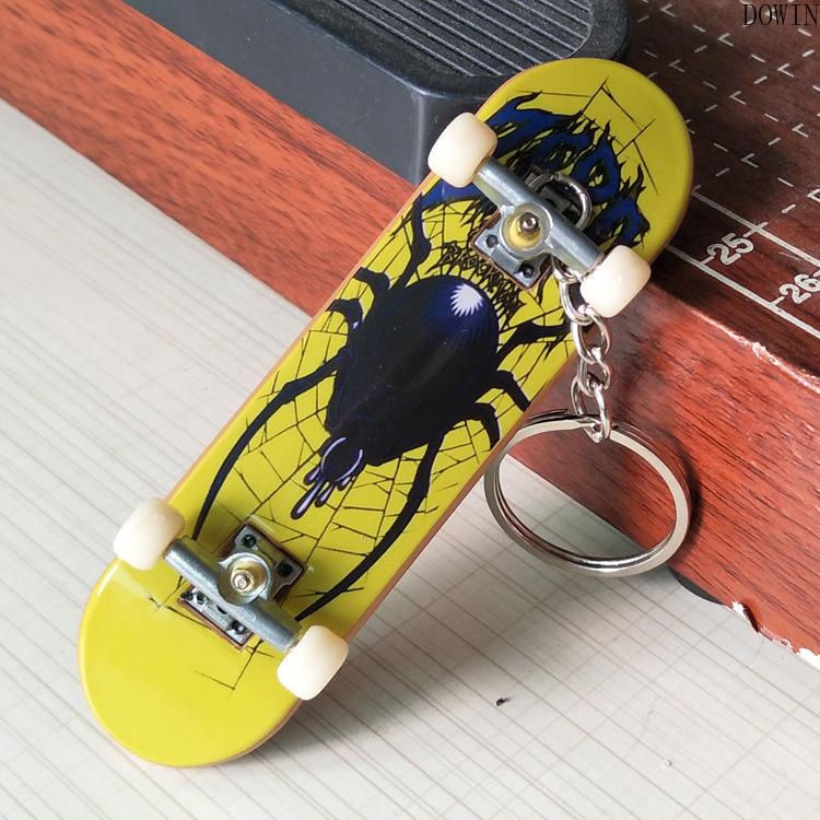 Изображение товара: Креативный мини Пальчиковый скейтборд гриф сплав стенты скраб скутер для пальца кататься с цепочкой для ключей, игрушки для детей