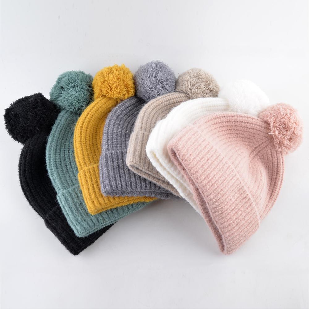 Изображение товара: Модные вязаные шерстяные шапки для женщин, зимние шапки, одноцветные, сохраняющие тепло, шапка с помпоном, Skullies, женская шапка Gorros, Дамская шапка